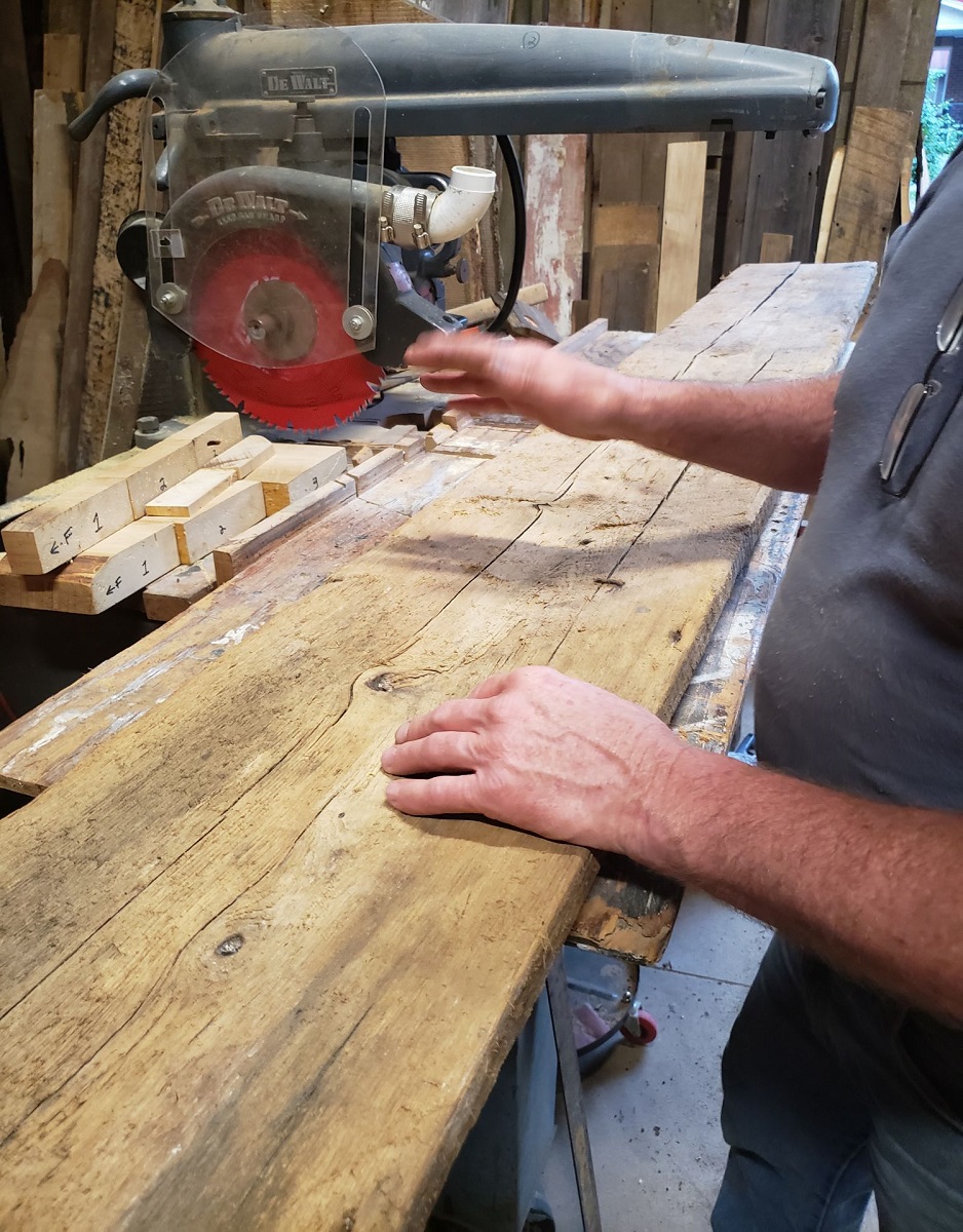 Jim working on a set of custom shelves in his workshop